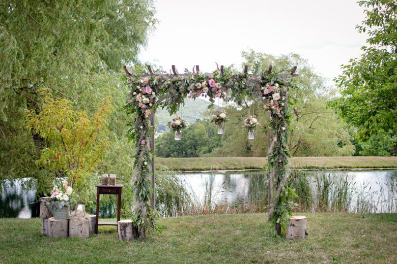 wedding arch adorned with flowers and greenery